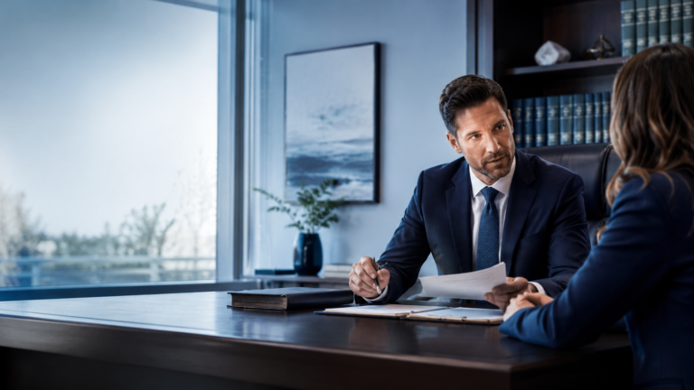 Attorney meeting with a client in a law office consultation.